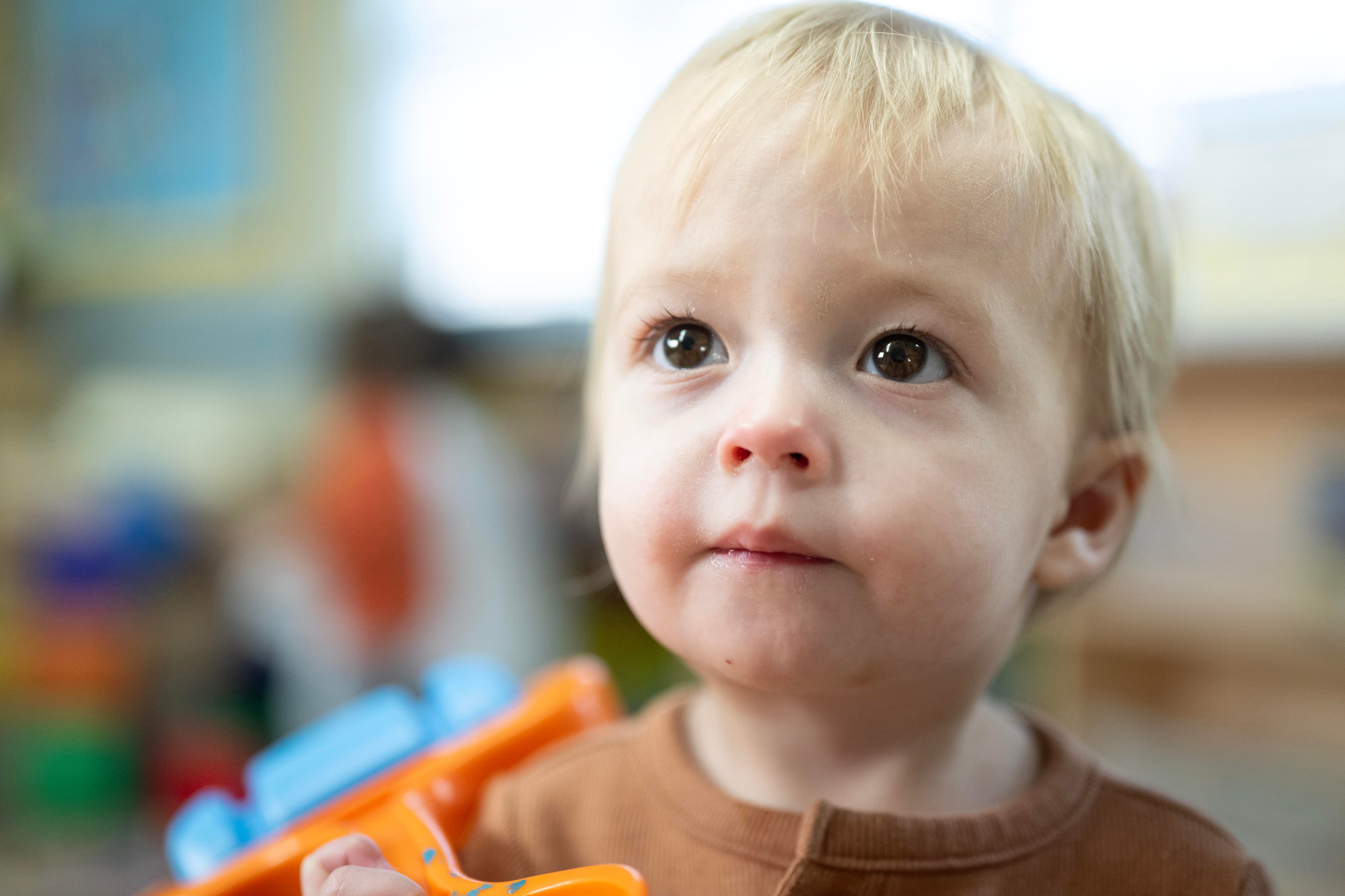 A young boy looking at camera