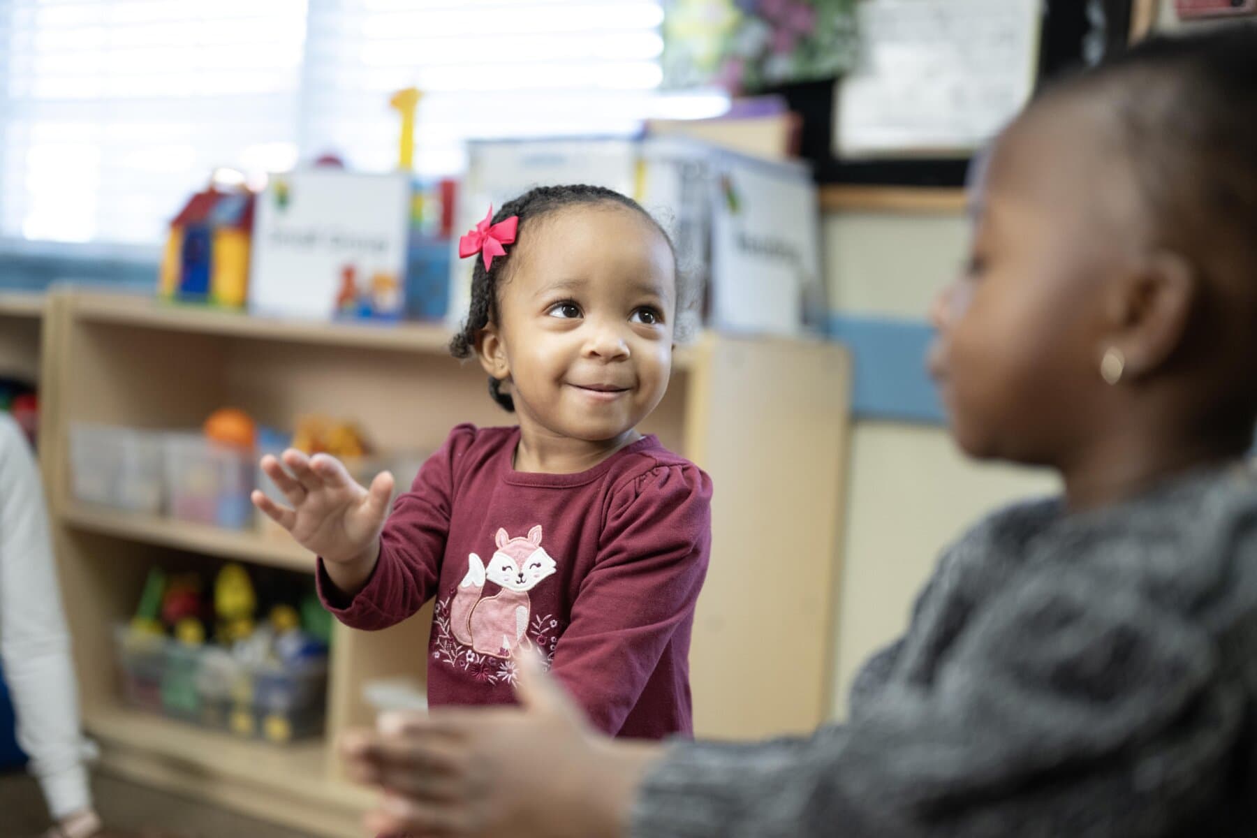 toddler child smiling and clapping