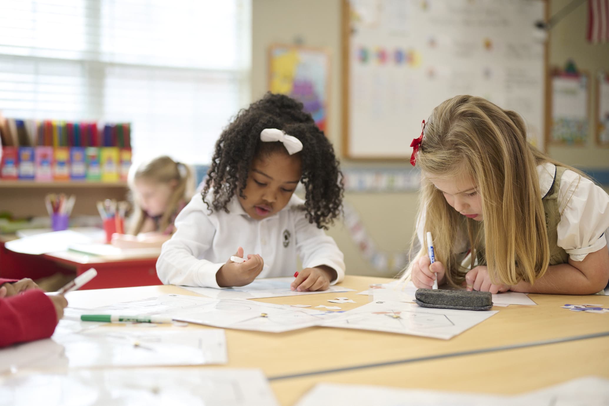 two kindergarten children completing classwork together