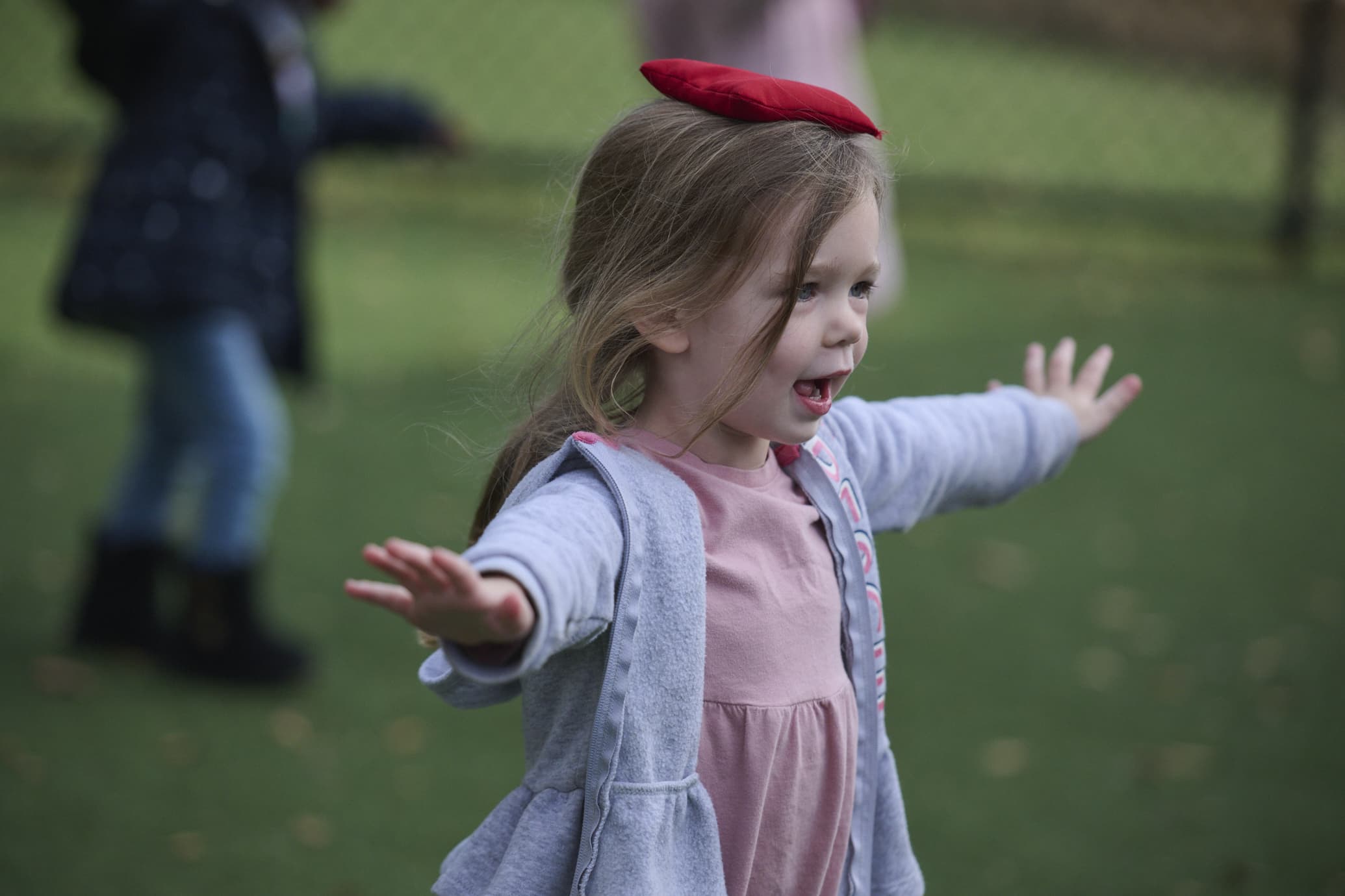 preschool child balancing a beanbag on their head