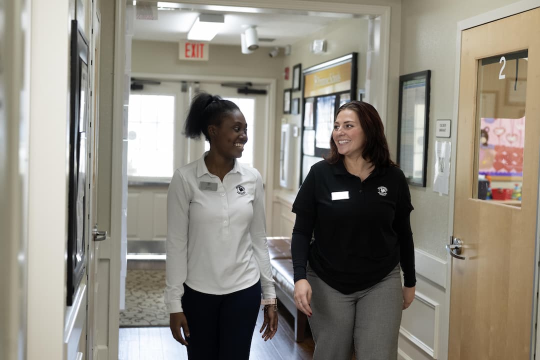 two teachers walking in a hallway